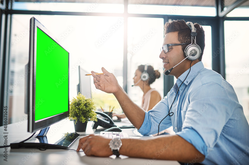 The best team to handle your queries. Cropped shot of a handsome young man working in a call center 