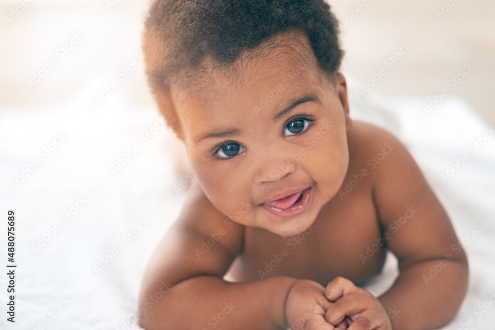 Here comes the cuteness. Shot of an adorable baby girl at home.