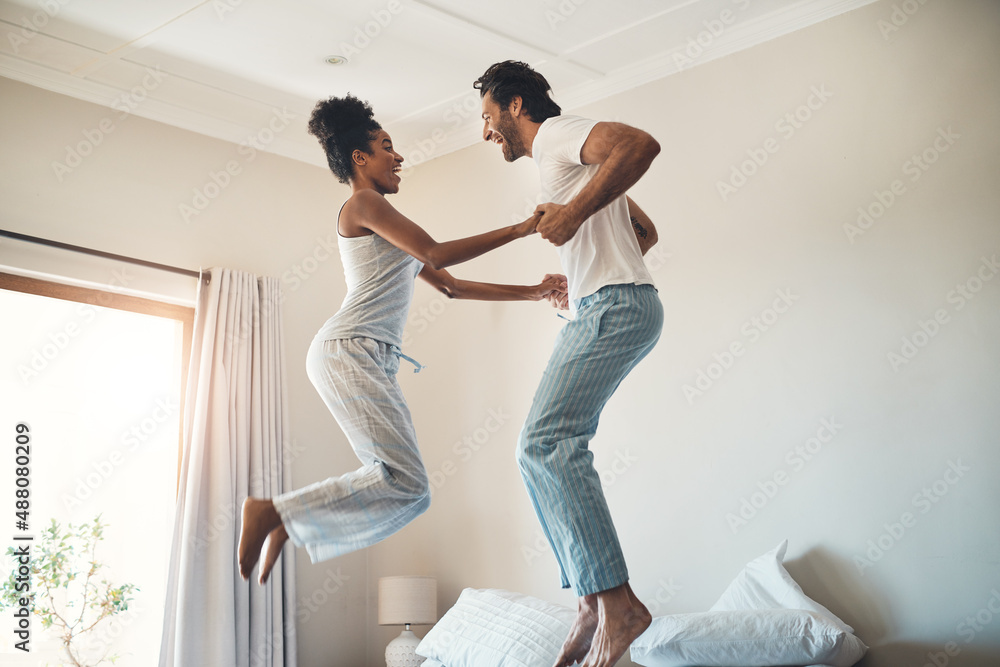 Theres so much fun in this relationship. Full length shot of an affectionate young couple jumping pl