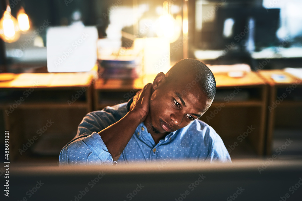 When its midnight and youre trying to make that deadline. Cropped shot of a handsome young businessm