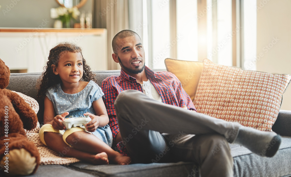 The only thing that cant be paused is bonding time. Shot of an adorable little girl and her father p