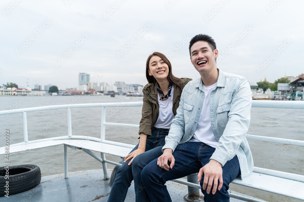 Asian attractive romantic couple travel in the city for honeymoon trip. 