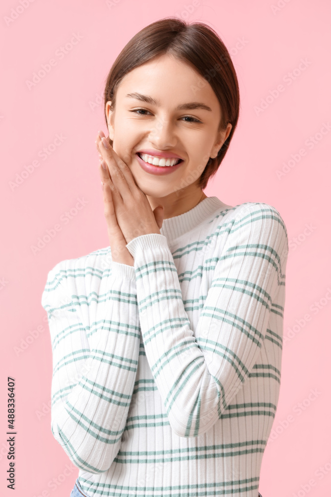 Portrait of pretty woman on color background