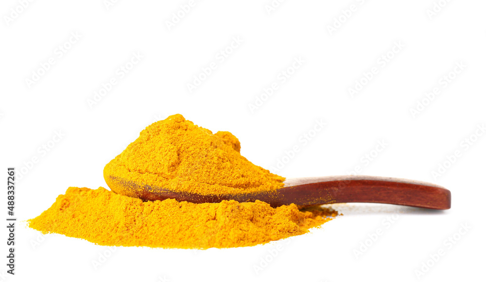 Spoon with turmeric powder isolated on white background