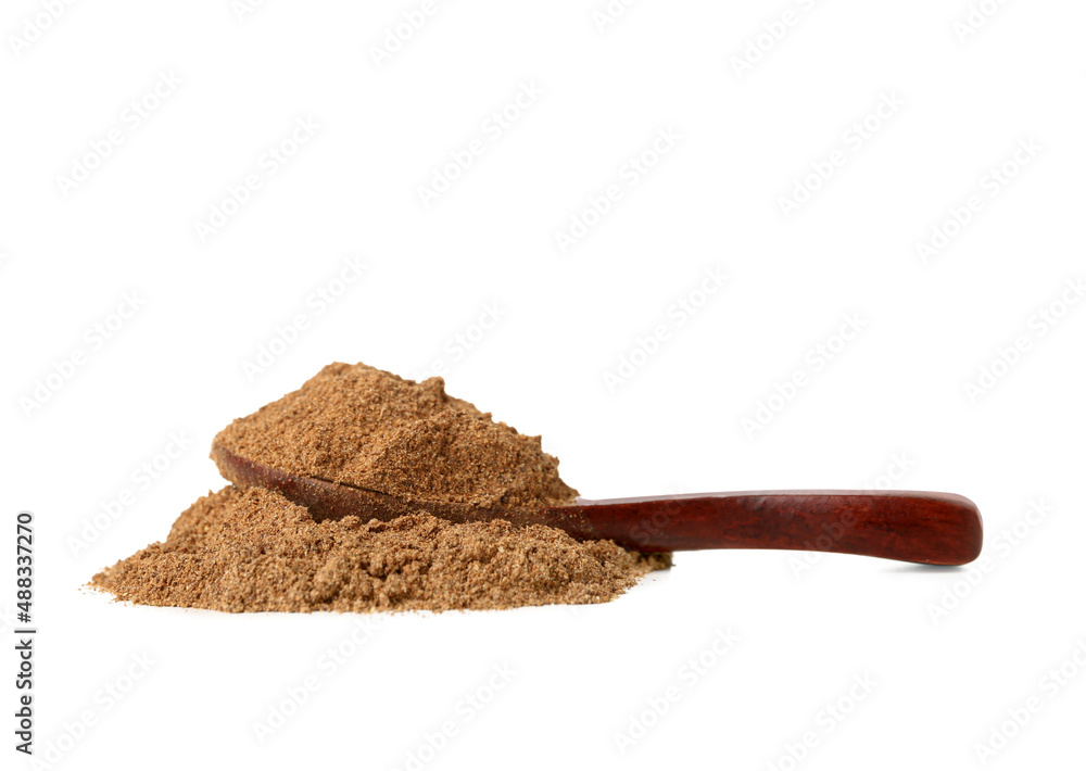 Spoon with cinnamon powder on white background