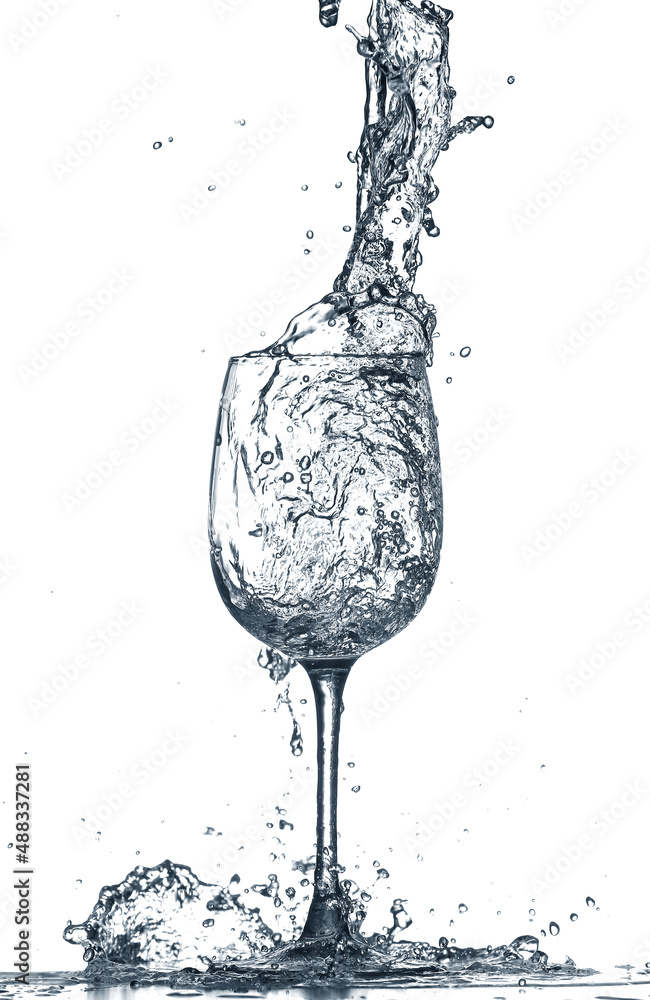 Glass of clean water with splash on white background