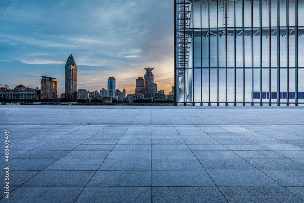 Empty square floor and city skyline with buildings in Shanghai at sunset, China.