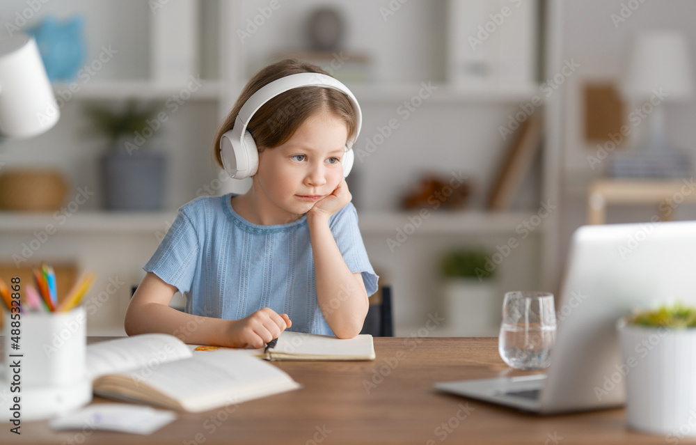 Girl doing homework or online education.