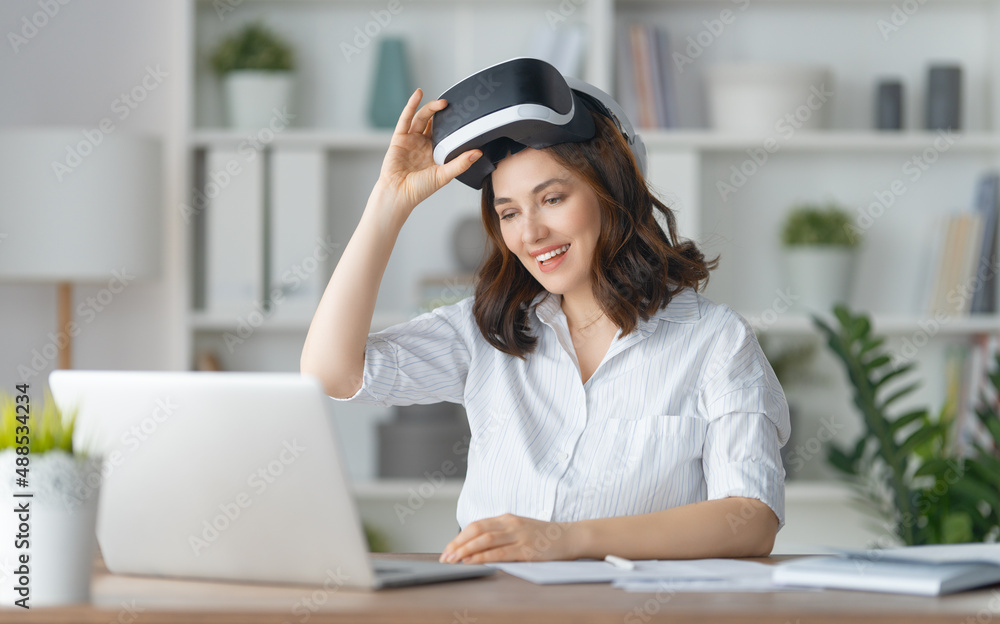 Woman with VR virtual reality goggles