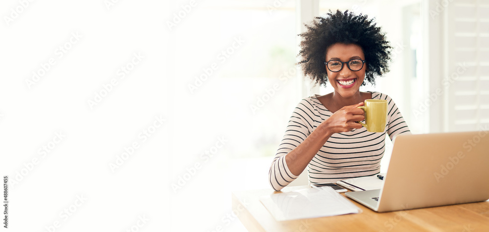 Nothing like a cup of comfort to start the day. Cropped portrait of a young woman drinking coffee wh