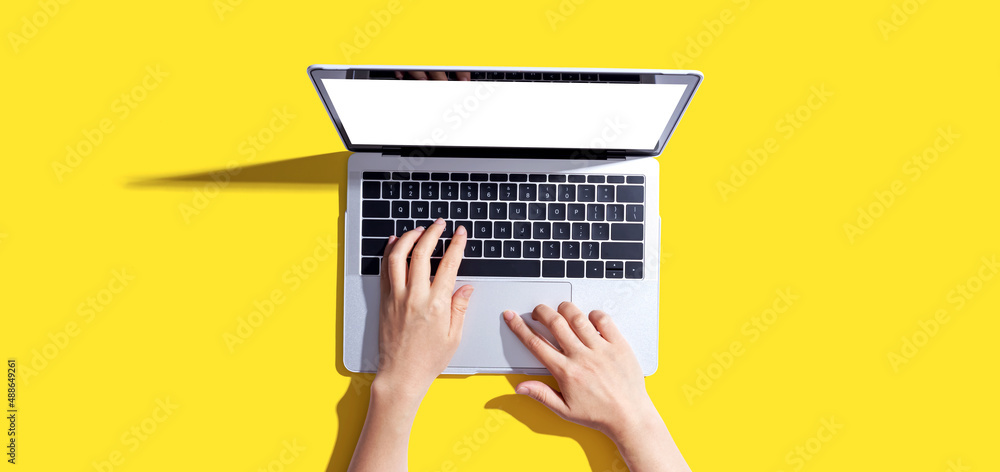 Person using a laptop computer from above