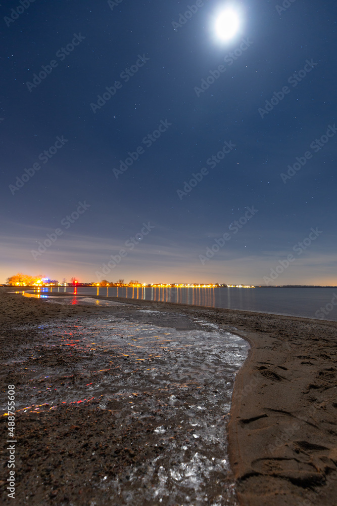 Frozen beach of the Baltic Sea in Rewa at night, Poland