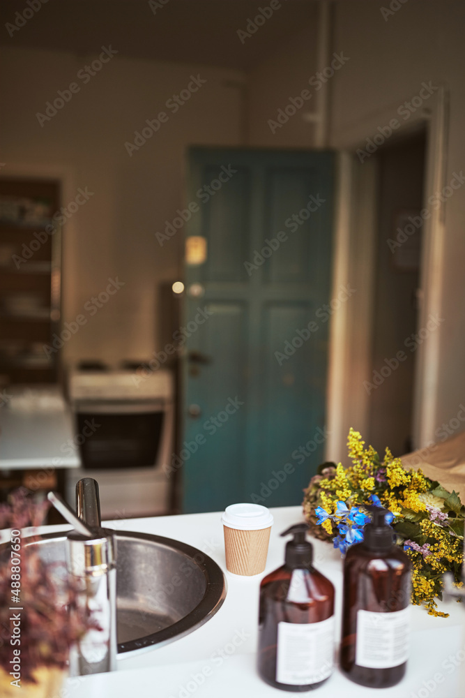 Bouquet of fresh flowers sitting on a kitchen counter