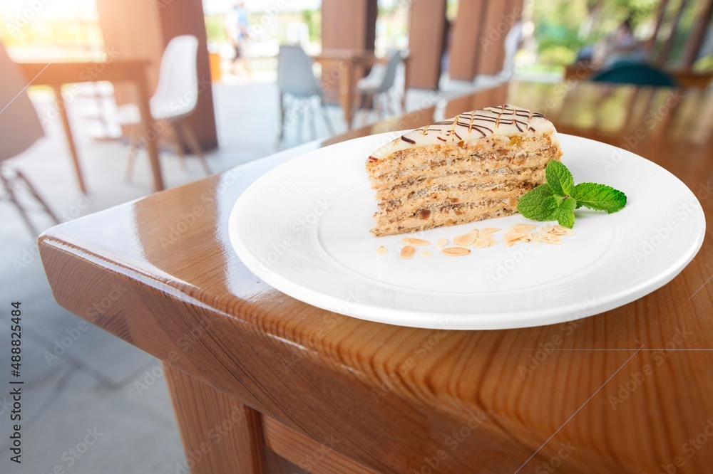 Honey cake slice on white plate