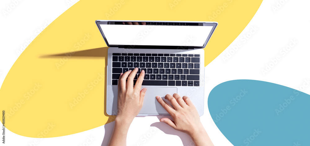 Person using a laptop computer from above