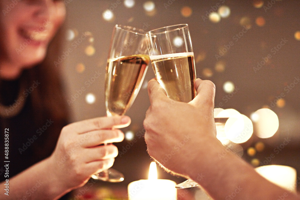 Heres to a love worth celebrating. Cropped shot of a couple toasting during a romantic dinner.