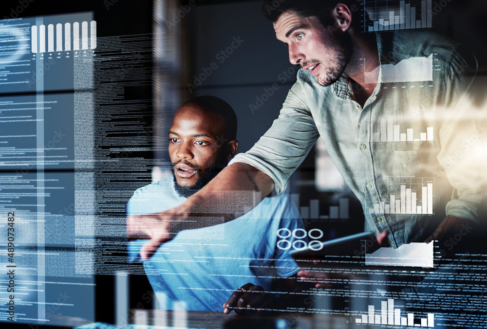 Lets test this algorithm. Shot of two programmers working together on a computer code at night.