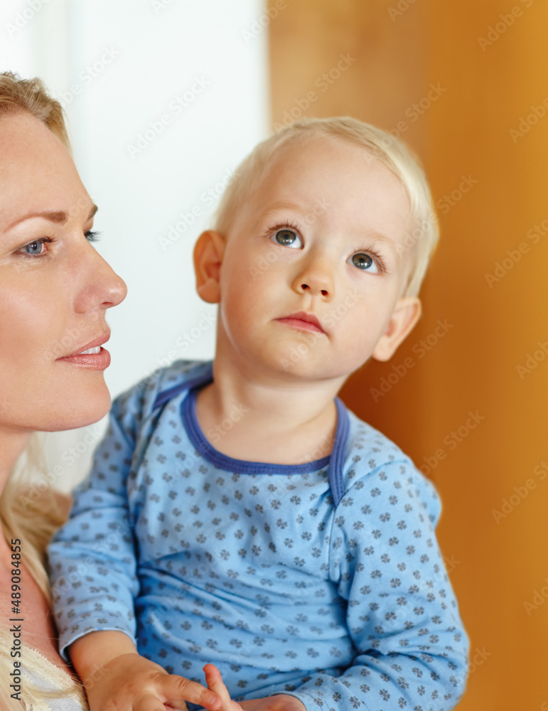 He has her eyes. A beautiful young mother holding her baby boy.