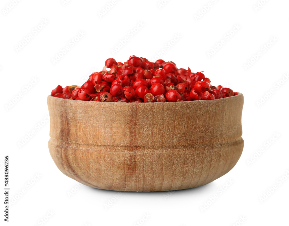 Wooden bowl of red peppercorns on white background