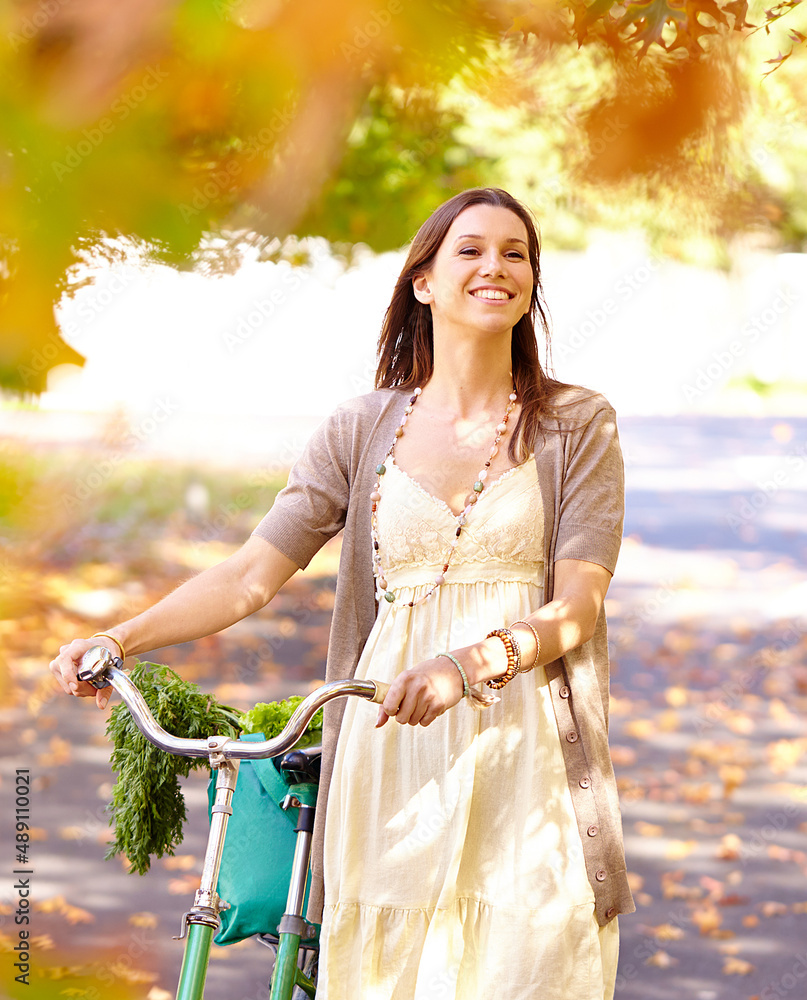 Autumn beauty. Shot of an attractive young woman in the park on an autumn day.