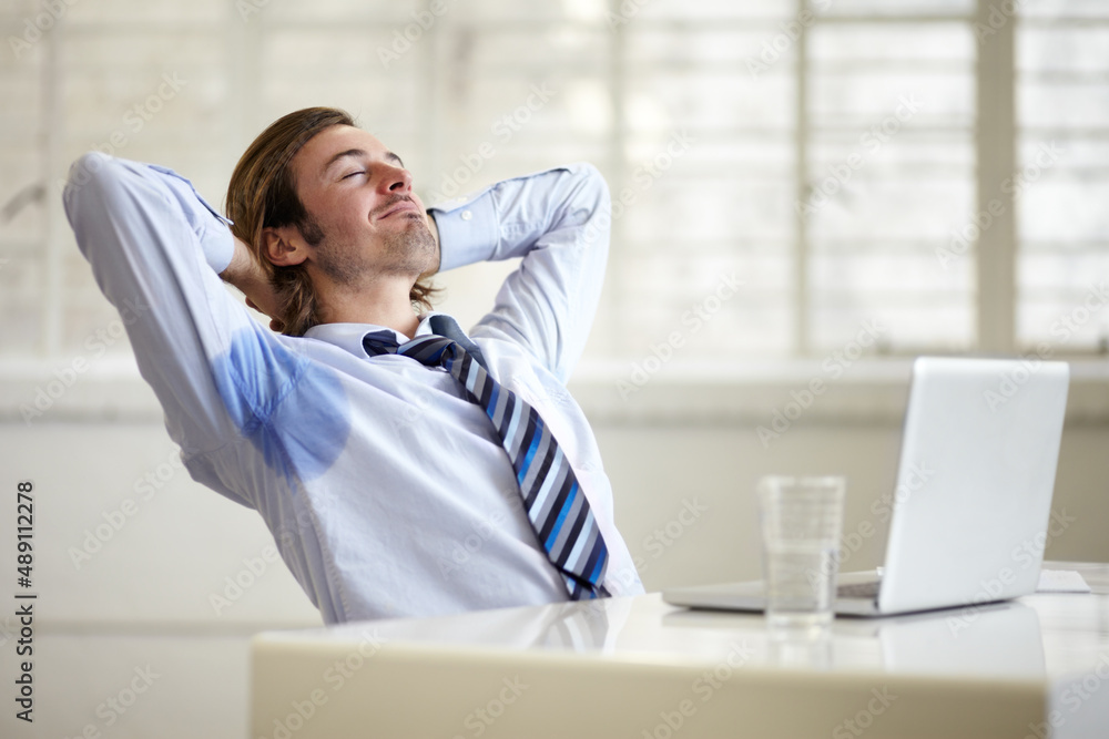 The scent of a true man. A young businessman with sweat stains under his arms at work.