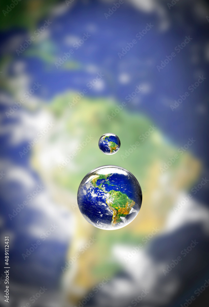 Water is the life-source of earth. Closeup shot of a water droplet above the earth.