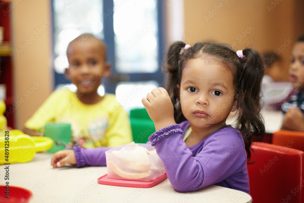 Getting some energy for the fun activites ahead. Pre-school children on their lunch break eating san