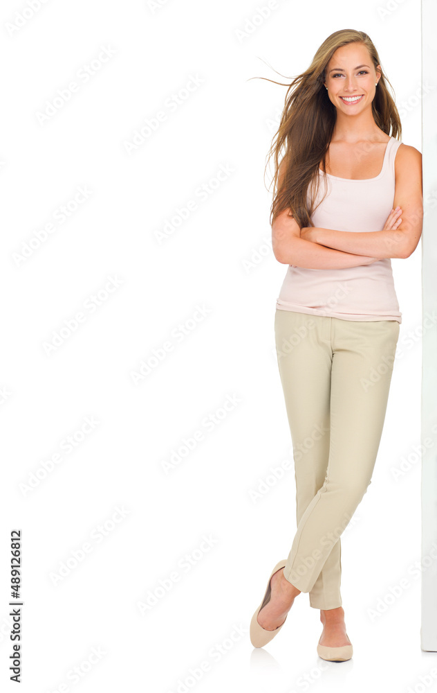 Taking time to smell the roses. Full-length portrait of a beautiful young woman in casual wear isola