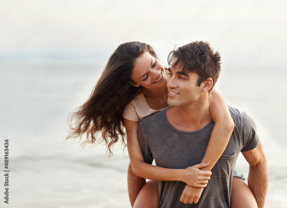 Ive always got your back, babe. Cropped shot of an affectionate young couple at the beach.