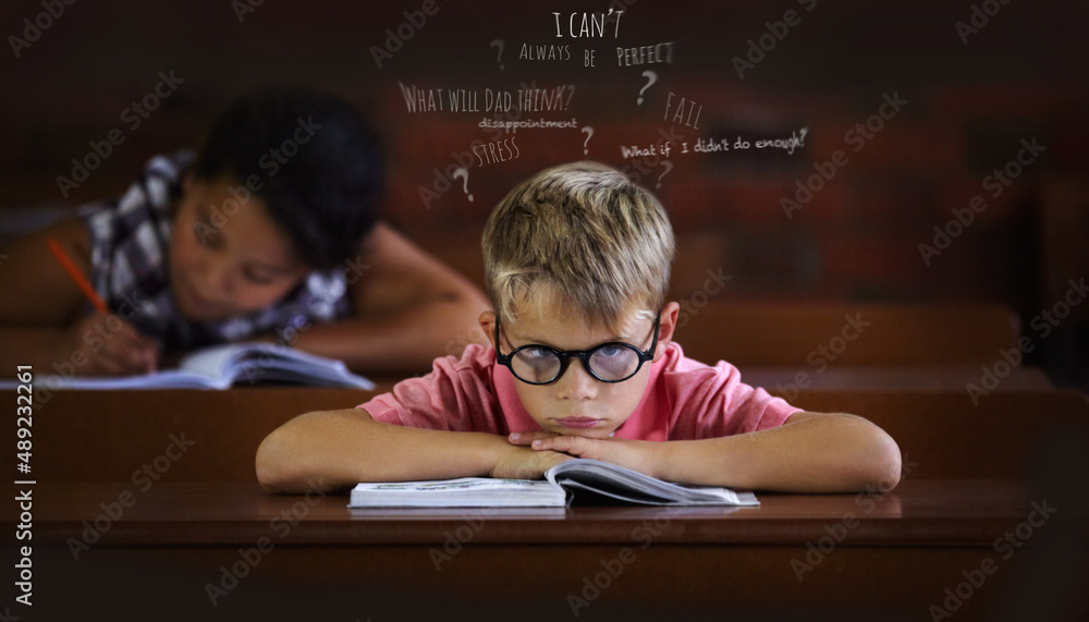 Confused and struggling to learn - Learning disabilities. Young boy feeling overcome with boredom in