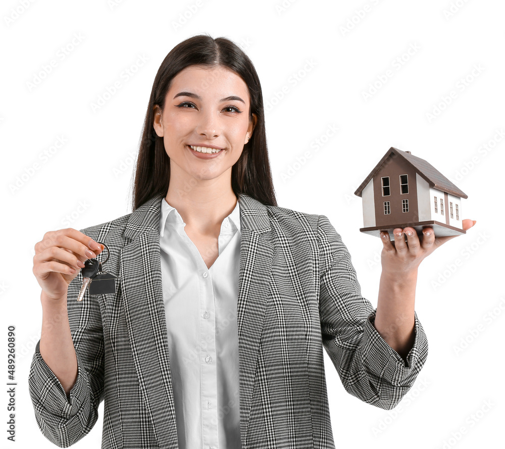 Real estate agent with figure of house and key on white background