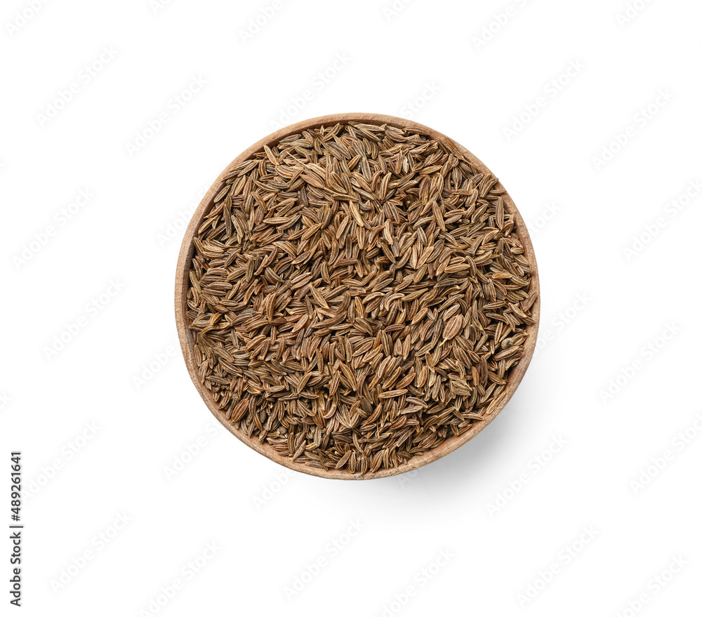 Bowl of cumin seeds isolated on white background