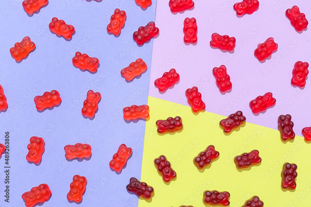 Yummy jelly bears on color background