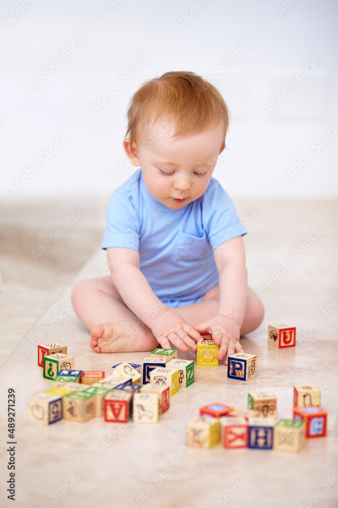 Growing up in the safety of home. Shot of an adorable baby boy in his home.