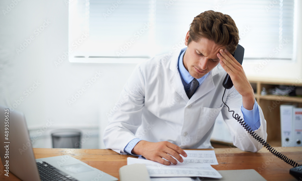 There has to be another treatment. Shot of a concerned doctor sitting in his office and talking on t