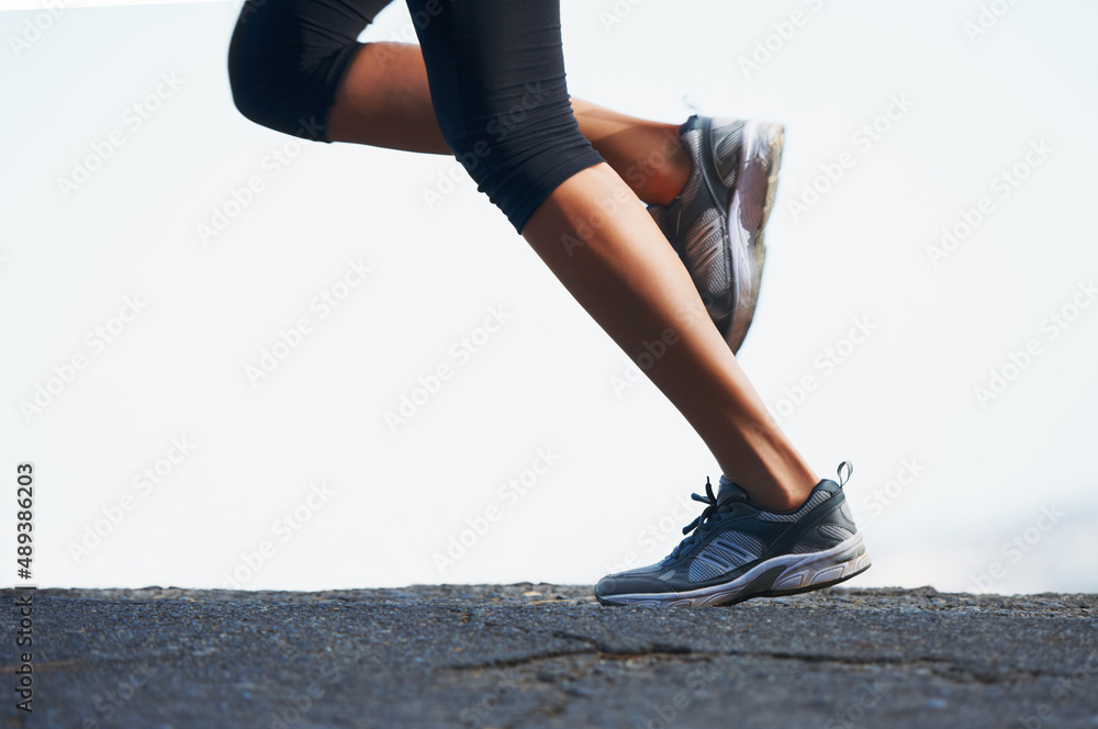 Going places. Cropped shot of a sporty woman going for a run outdoors.