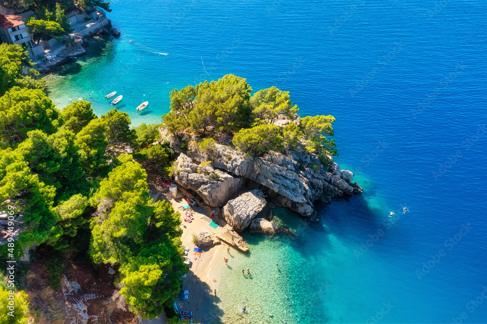 Mediterranean sea. Aerial view on the beach and rocks. Top view from drone at beach and azure sea. T