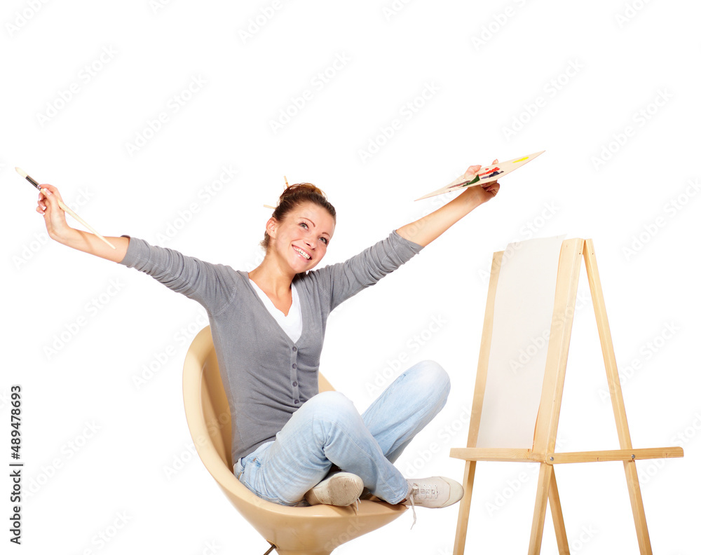 Searching for inspiration. Studio shot of a young woman holding a palette and brush looking for insp