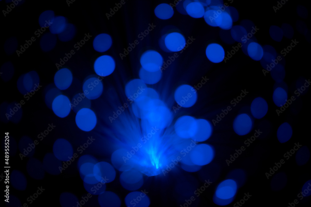 Defocused light. Illustration of beams of light against a dark background.