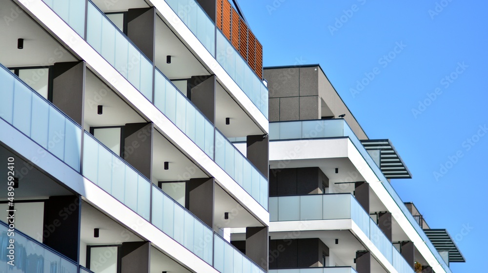 Fragment of modern residential apartment with flat buildings exterior. Detail of new luxury house an