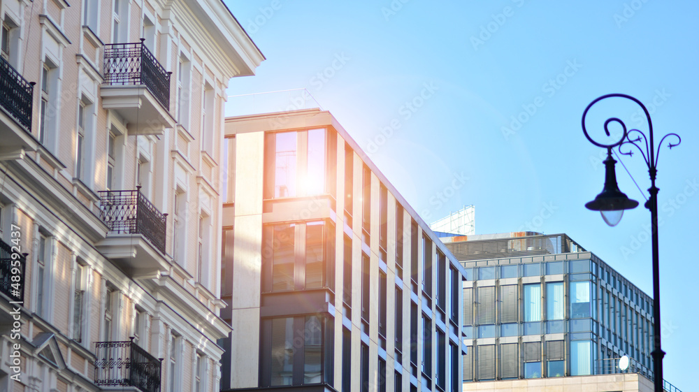 A residential building and an adjacent office building. Modern urban development.