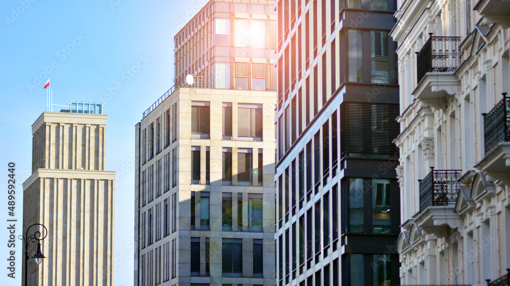 A residential building and an adjacent office building. Modern urban development.