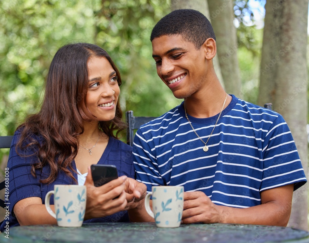 These are the moments we live for. Shot of a young couple on a date at a outdoor cafe.