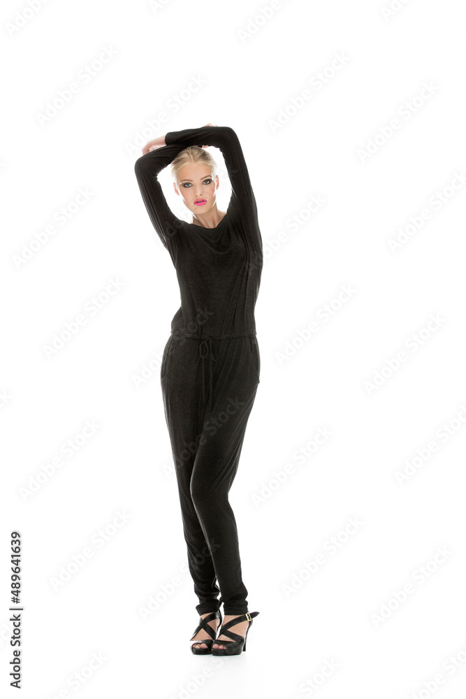 Striking a pose. Full-length portrait of a fashionable young woman isolated on white.