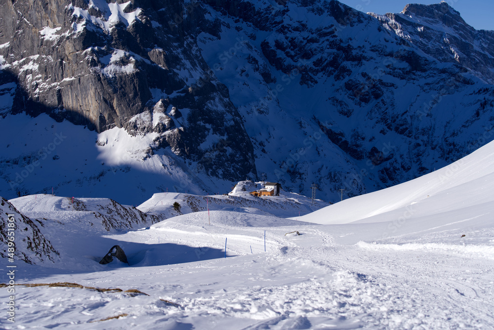 Hiking trail with alpine landscape in the Swiss Alps seen from ski resort Engelberg Fürenalp on a su