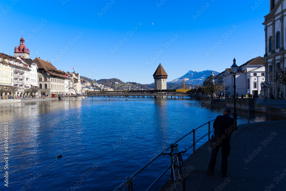 Medieval old town of Luzern with famous covered wooden Chapel Bridge (German: Kapellbrücke) and ston