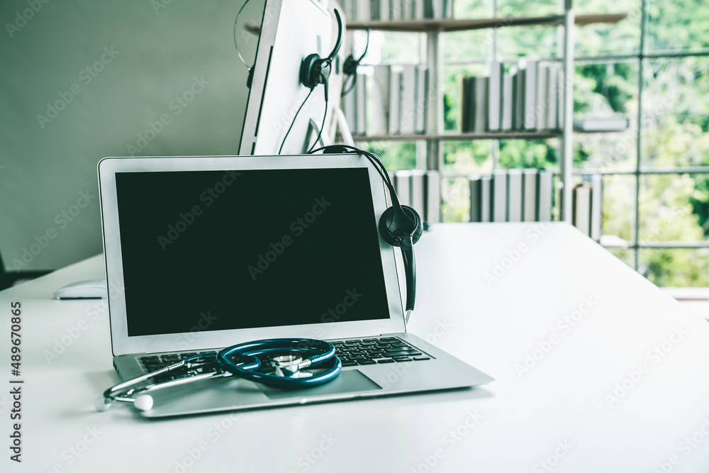 Headset and doctor equipment at clinic ready for actively support for patient by online video call .