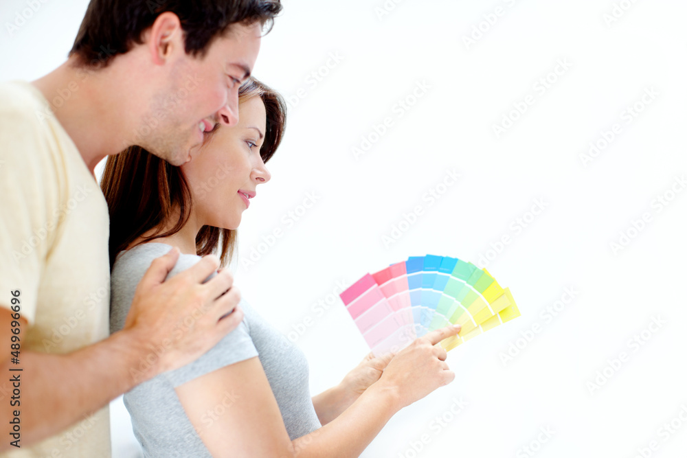 What colour would you pick - Copyspace. Over the shoulder image of a young couple picking a colour f