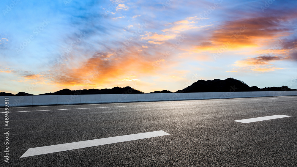 Empty asphalt road and beautiful sky sunset clouds background