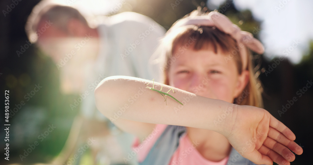 Look at what Ive found. Shot of a young girl discovering bugs in her backyard.